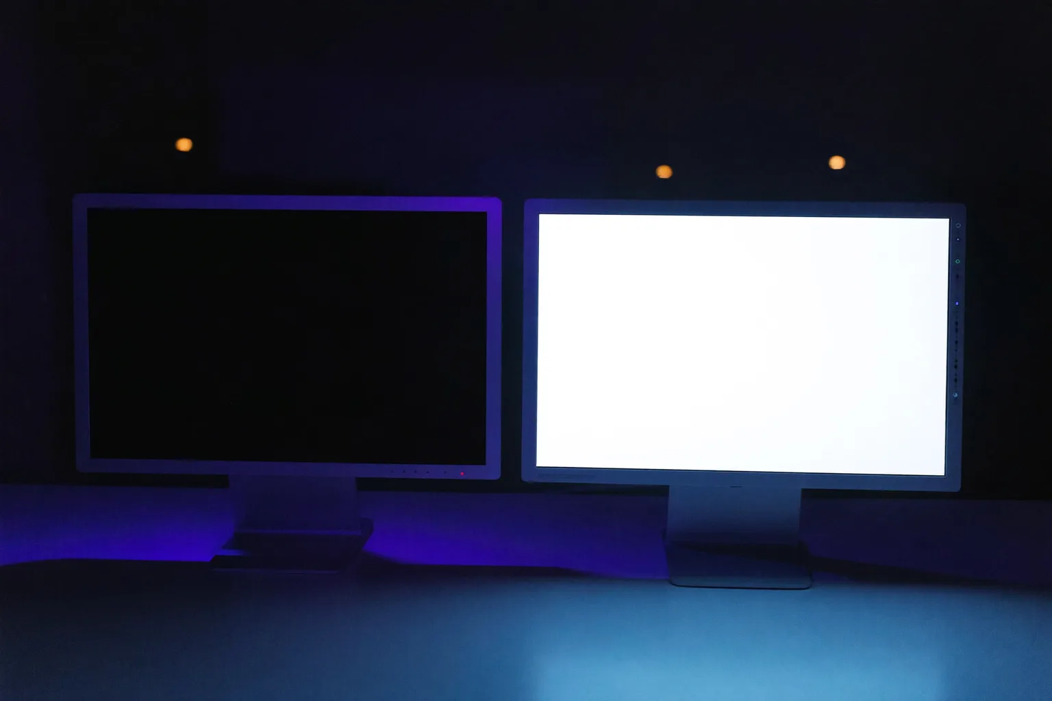 One monitor in a dimly lit room showing the same page of text twice, dark mode on the left half and light mode on the right half, the contrast polarity question behind dark mode and eye strain